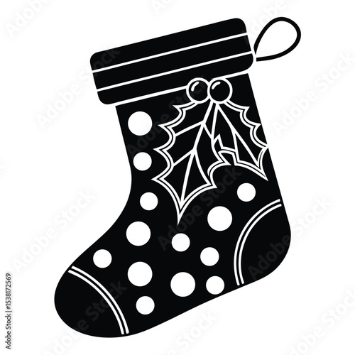 Black and white festive christmas stocking decorated with holly and polka dots for holiday season