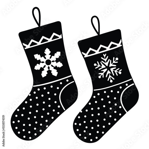 Christmas stockings with snowflake decorations in black and white for seasonal holiday design