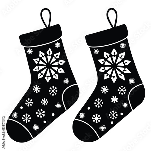 Black and white vector illustration of festive christmas stockings decorated with snowflakes