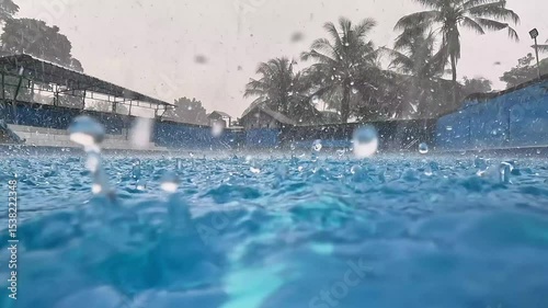 Raindrops falling in the swimming pool. Clean swimming pool.