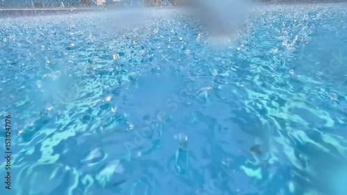 Raindrops falling in the swimming pool. Clean swimming pool.