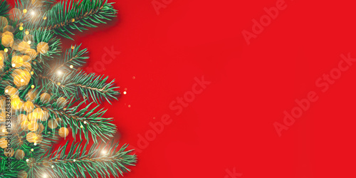 Fir branches on red background. Christmas wallpaper. Flat lay, copy space.