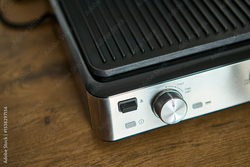 Fototapeta premium This electric grill has a nonstick surface and adjustable temperature controls for your convenience