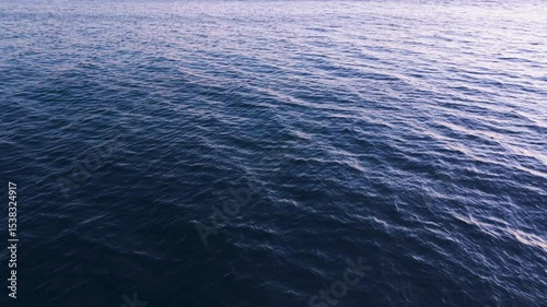 Aerial flying over the blue ocean