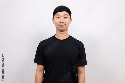 Young Thai man black shirt cheerful with happy smile look at camera crop half body portrait on isolated white