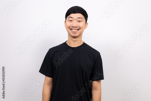 Young Thai man black shirt cheerful with happy smile look at camera crop half body portrait on isolated white