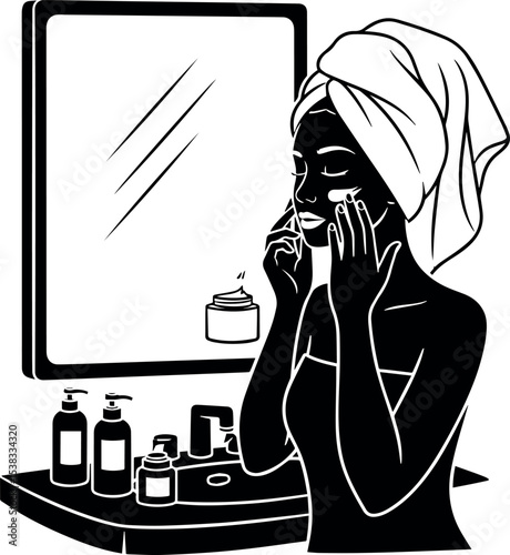 Woman applying face cream in bathroom mirror