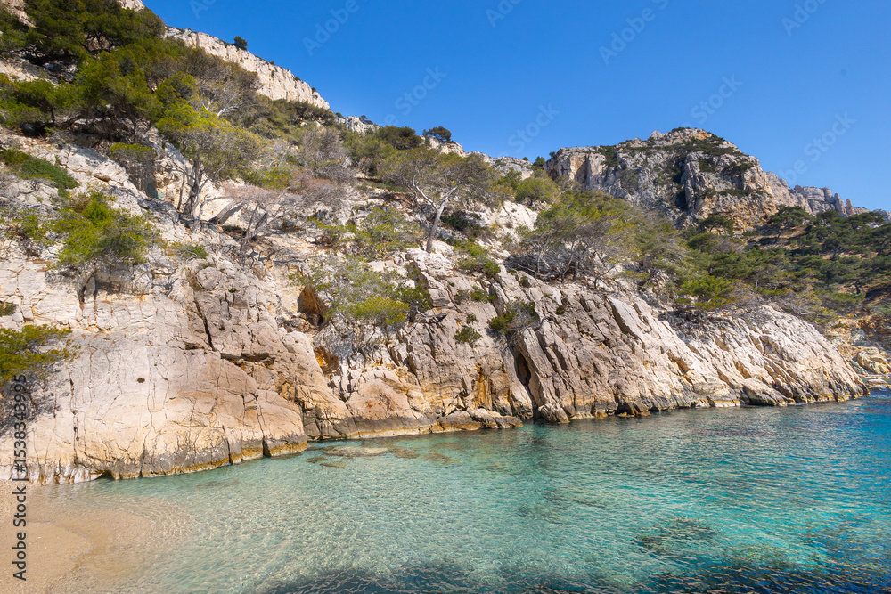 Fototapeta premium Calanque de Sugiton, Marseille, Dramatic limestone cliffs and turquoise waters along the Mediterranean coast of southern France
