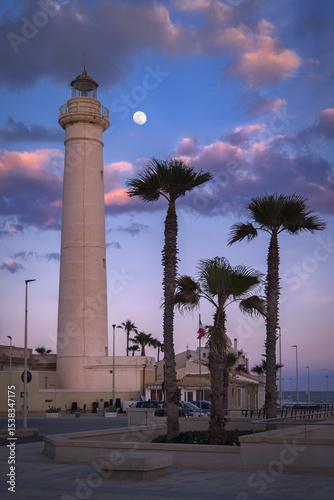 Moonlit Skies Over Punta Secca Lighthouse Bring Peaceful Sicily Night, Italy