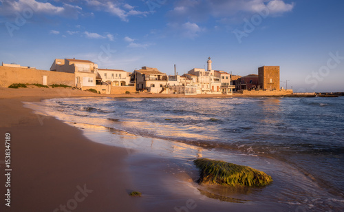 Golden Sands and Tranquil Waters at Punta Secca in Ragusa, Sicily, Italy