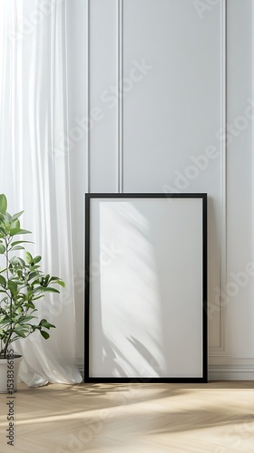 Wallpaper Mural Black frame mockup on floor with sheer curtains, potted plant, and wainscoting background Torontodigital.ca