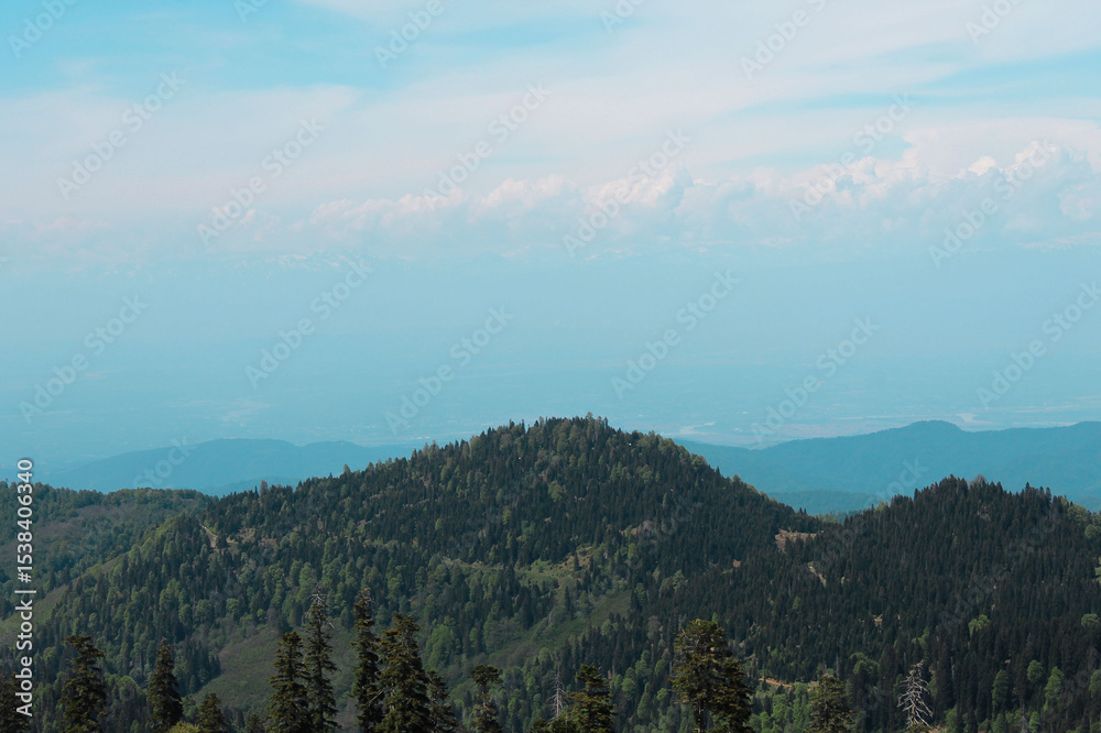 Fototapeta premium Georgia Baxmaro mountain landscape with beautiful clouds and blue view, Beautiful view of nature and mountain in Georgia Baxmaro, Baxmaro beautiful view of the mountain on soft blue background
