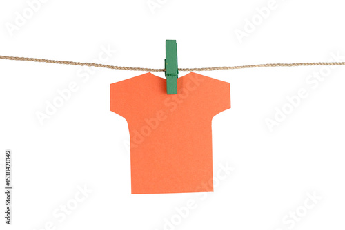 A piece of T-shirt shape orange paper hang on a rope