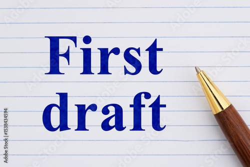 First draft concept on white lined loose leaf notebook paper with pen