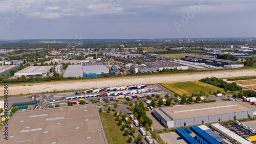 Canvas Print A large industrial area with many trucks and buildings