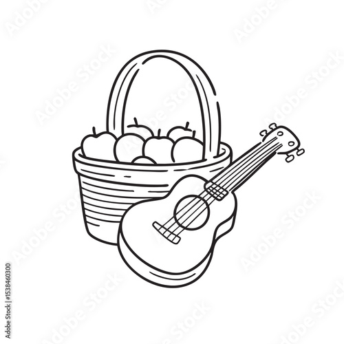 A ukulele placed near a picnic basket with assorted fruits