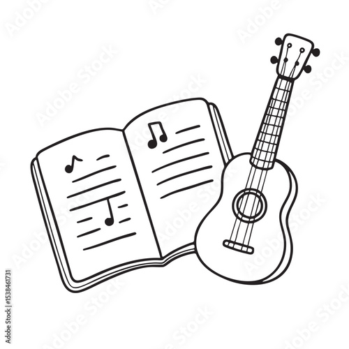 A ukulele placed close to an open music notebook
