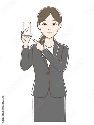スマホを指さすスーツの女性