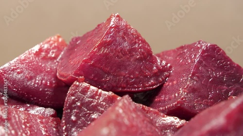 Boiled red beetroot cut into pieces, close-up shot