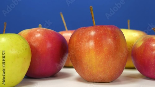 Ripe fresh juicy apples at dark blue background