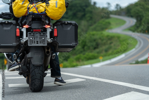 motorcycle on the road rides away. Travel on vacation, enjoy the nature trail. motorcycle in a sunny motorbike on the road riding.with sunset light. copyspace for your individual text.	