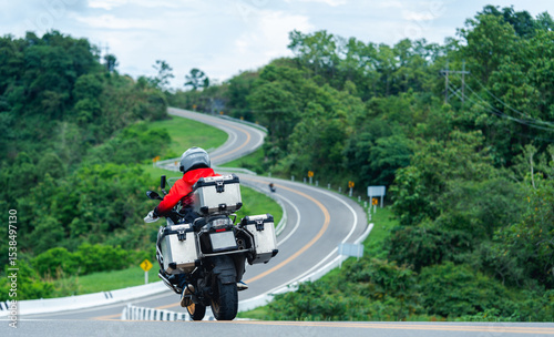 motorcycle on the road rides away. Travel on vacation, enjoy the nature trail. motorcycle in a sunny motorbike on the road riding.with sunset light. copyspace for your individual text.	