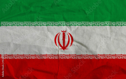 Close-Up of Iranian National Flag on Fabric with Textured Detail