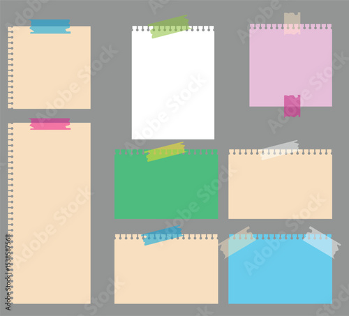 collection of colorful spiral notepapers with tape on gray background used for reminders	