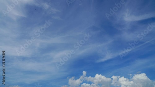 Time-lapse of clouds and blue sunny sky,  white clouds over blue sky, Aerial view,  nature, blue sky, white clear weather.