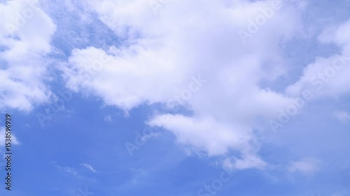 Timelapse of clouds and blue sunny sky,  white clouds over blue sky, Aerial view,  nature, blue sky, white clear weather.