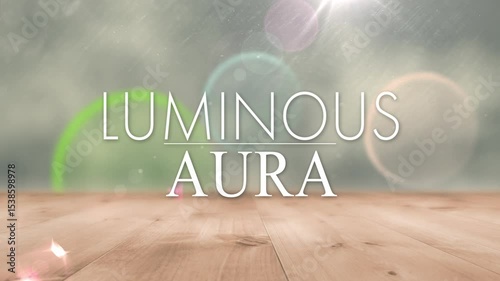 Fading in LUMINOUS AURA aligning on studio floor, with drifting orbs and underline for title reveal