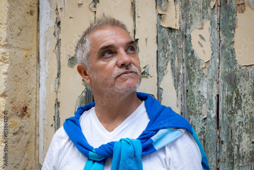 Portrait of a middle-aged European-looking man with modern gray hair