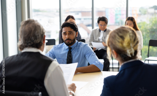Human resources : company, successful deal. Human resources manager interviewing applicant at modern office.  Indian man candidate job interviewing and answering question hr CV recruiter