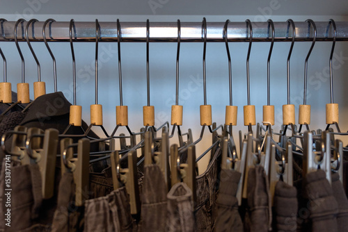 Stylish clothing arranged on hangers in a boutique