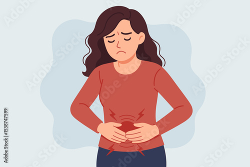 Woman suffering from stomach ache. Girl feeling abdominal pain, menstrual cramps, or indigestion. Concept of gastritis, PMS, period problems, and digestive disorders.
