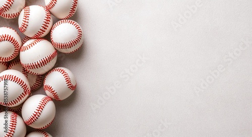White Baseballs with Red Stitching Arranged on a Neutral Background