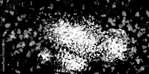 Snowflakes on dark background. white icy snowflakes isolated on black background, natural background. white crystalline powder on a black background. sugar dust. texture, pattern and clipping.
