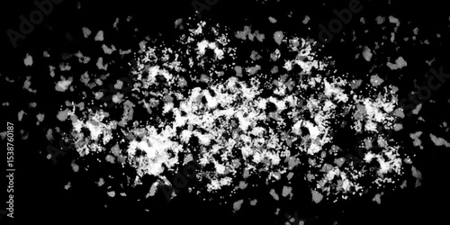 Snowflakes on dark background. white icy snowflakes isolated on black background, natural background. white crystalline powder on a black background. sugar dust. texture, pattern and clipping.