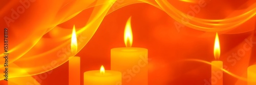 Burning candles with orange fabric drape background