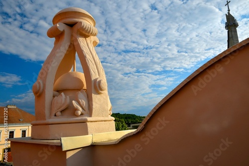 View of the newly built roof on a historic house. New roof covering with a historical element. Concept of house history and construction