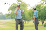 Good shot buddy. Shot of two happy men playing a game of golf. Golf, friends and sport with men on course playing