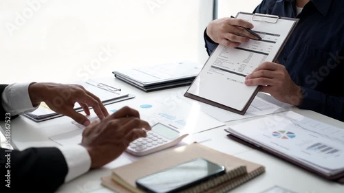 Team of Businesspeople meeting analysis statistics brainstorm working on business statistics and marketing plans together planning success strategy