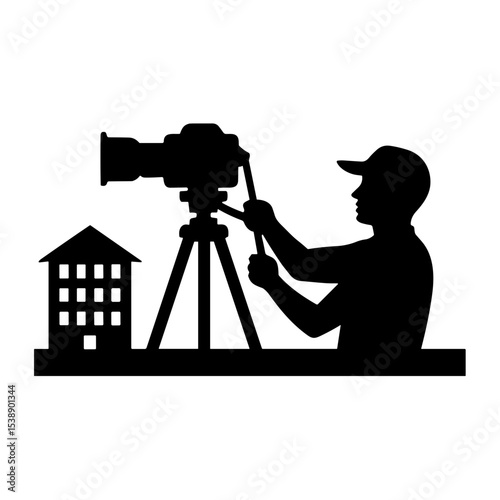Silhouette of a man photographing a building as an architectural photographer  