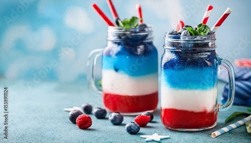 4th july layered frozen drink with blue red and white colors in mason jar garnished with blueberries and mint for festive celebration