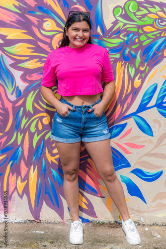Fashionable Latina Model Posing Confidently by Graffiti Wall