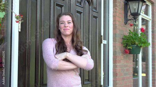 Confident young woman business owner in front of store 4k
