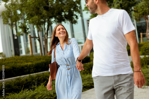Couple enjoys a sunny strol...