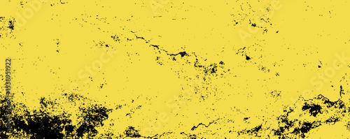 Bright yellow abstract texture with dark speckles and a rough appearance enhancing artistic expression