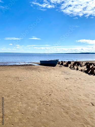 A boat on the riverbank. A sunny day.