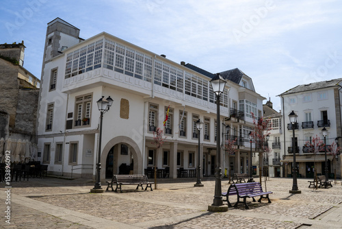 Historic Praza do Concello in Mondoñedo, Lugo, Spain, with traditional Galician architecture under a clear sky.